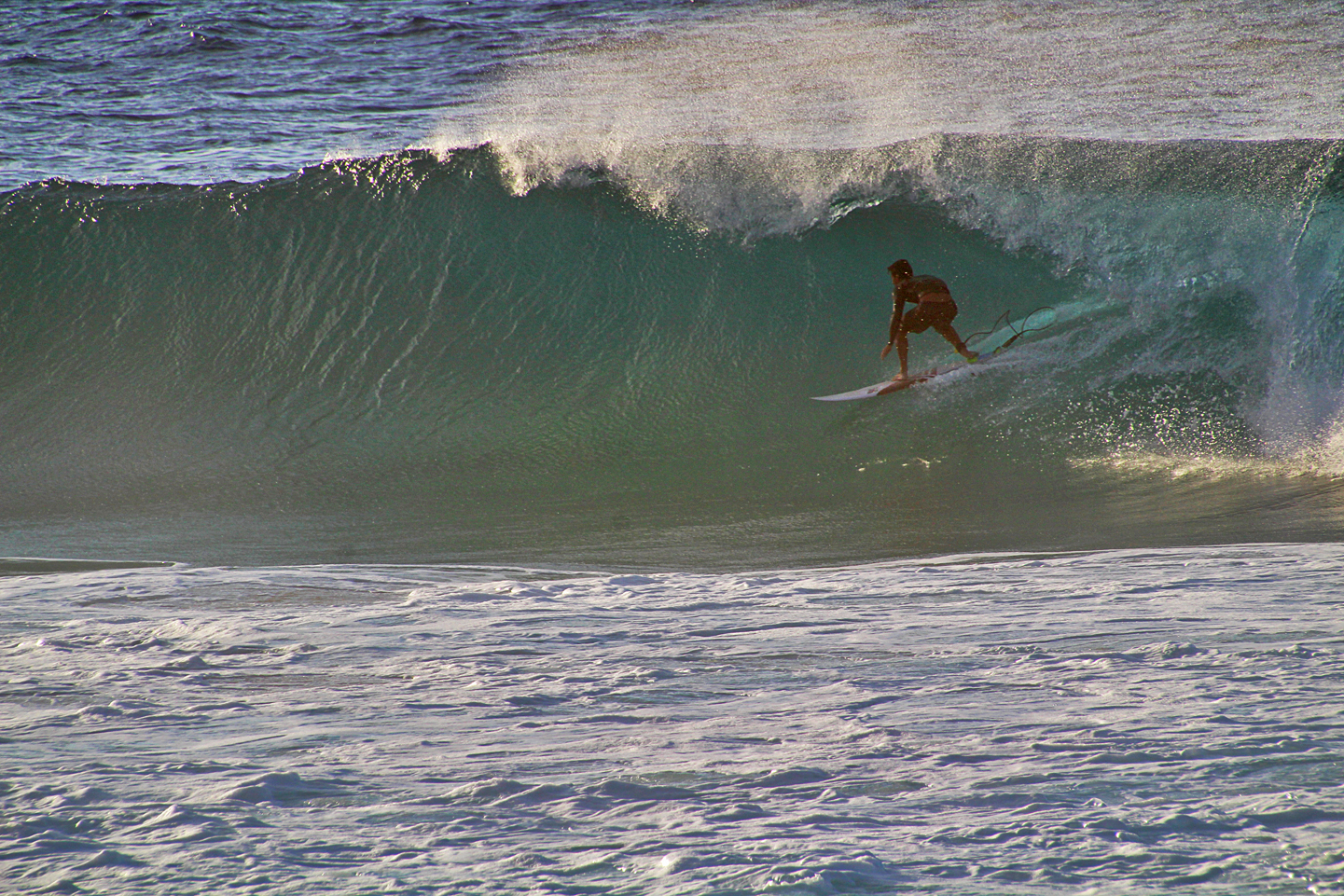 Surfer setting up for the barrel at Pipeline.